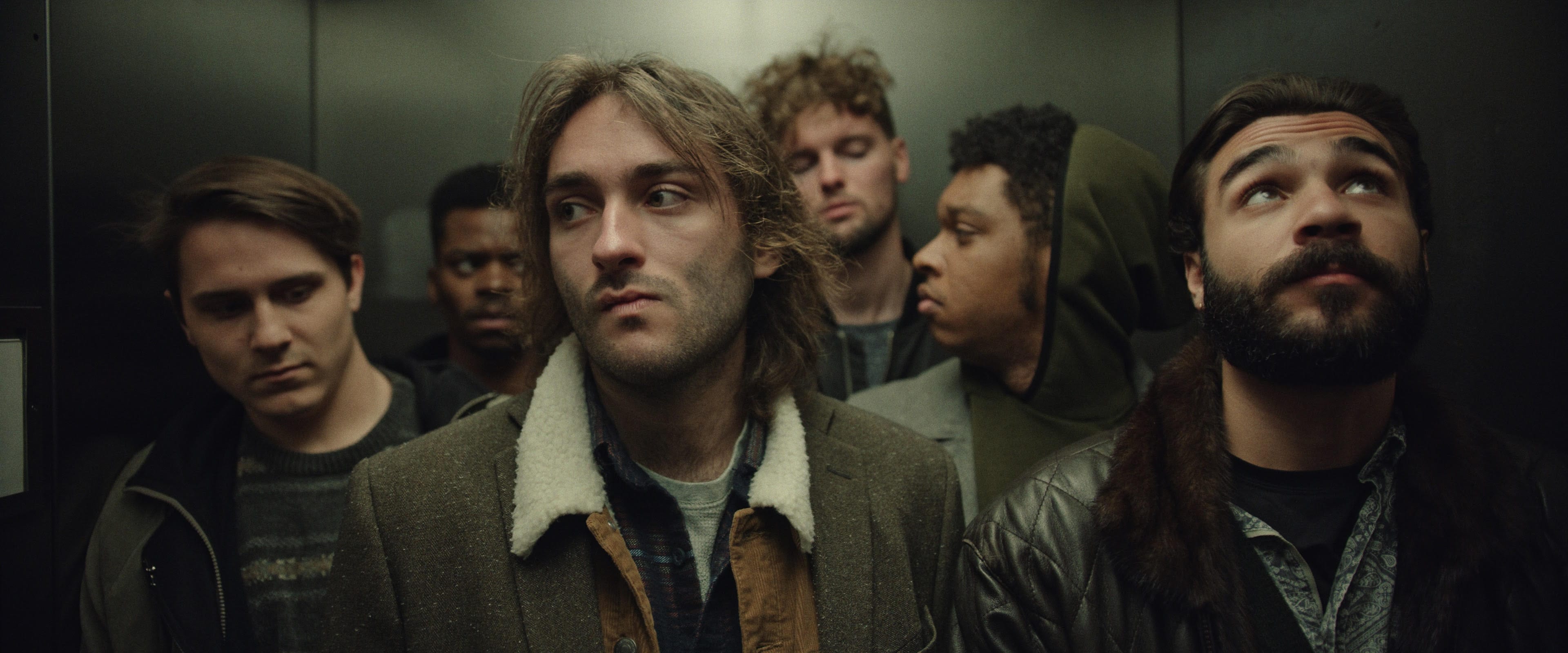 Film Frame - In an Elevator; (L to R) Keegan Garant, Rashaad Martin, Richard Follin, Peter Block, Christopher Martin, Dillon Douglasson