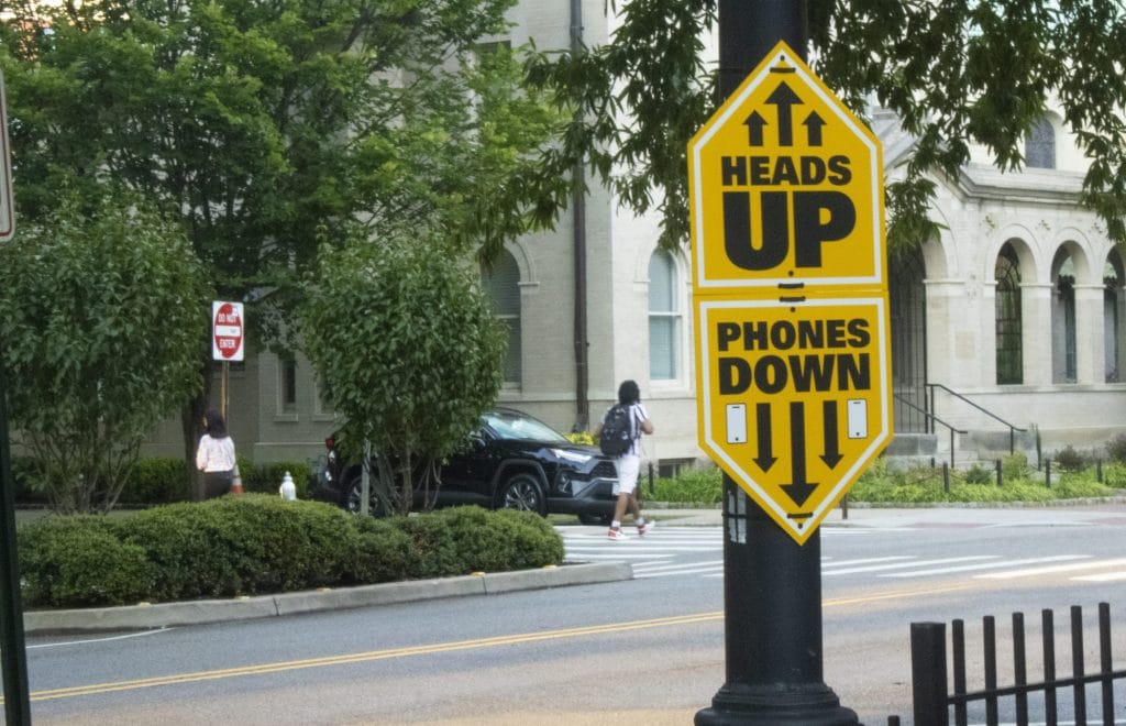 ‘Heads up’: New signs around campus aim to alert pedestrians